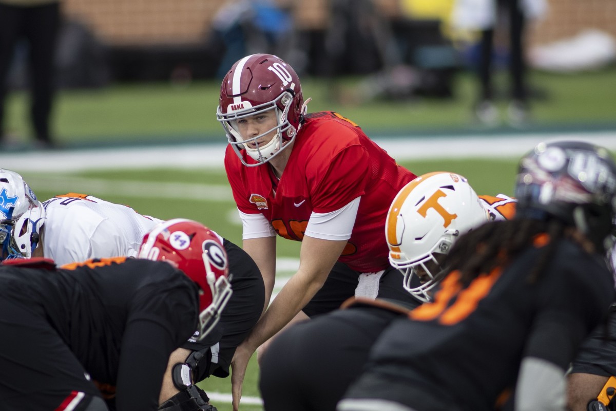 American quarterback Mac Jones of Alabama (10) runs a play in drills during National team practice during the 2021 Senior Bowl week.