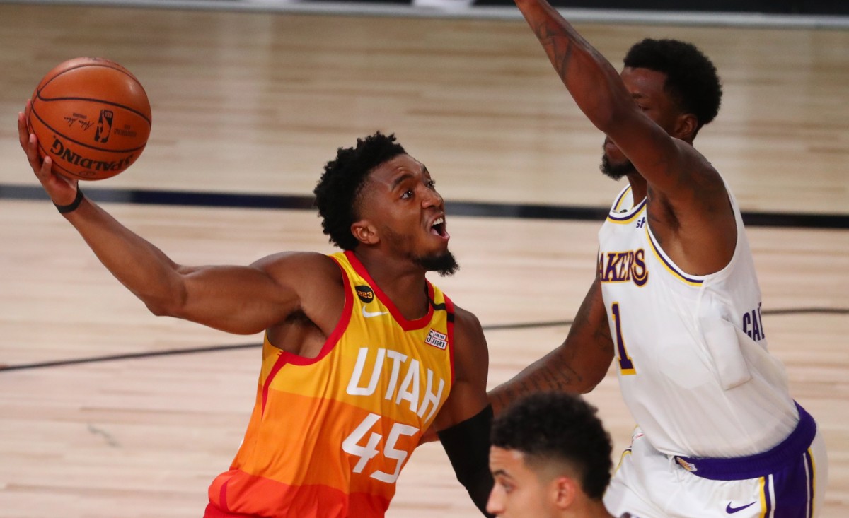 Donovan Mitchell (45) drives through the paint for a layup