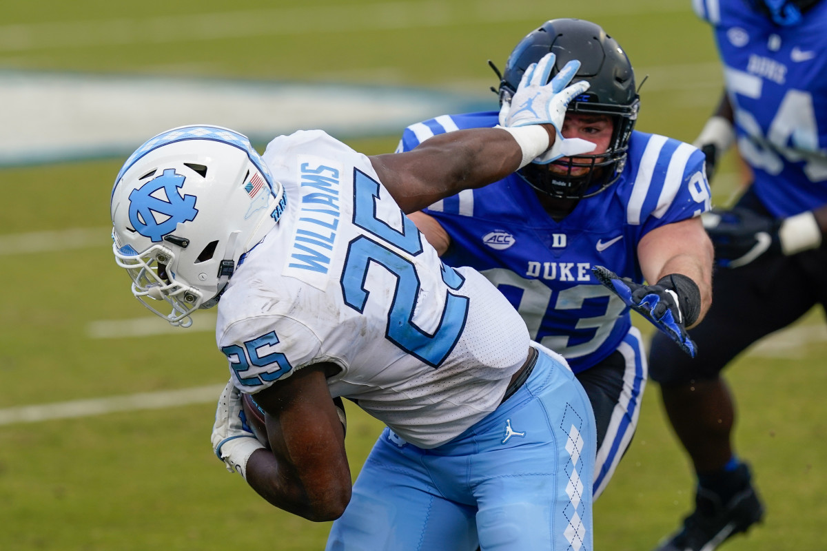 Javonte Williams and Michael Carter Each Selected to Doak Walker