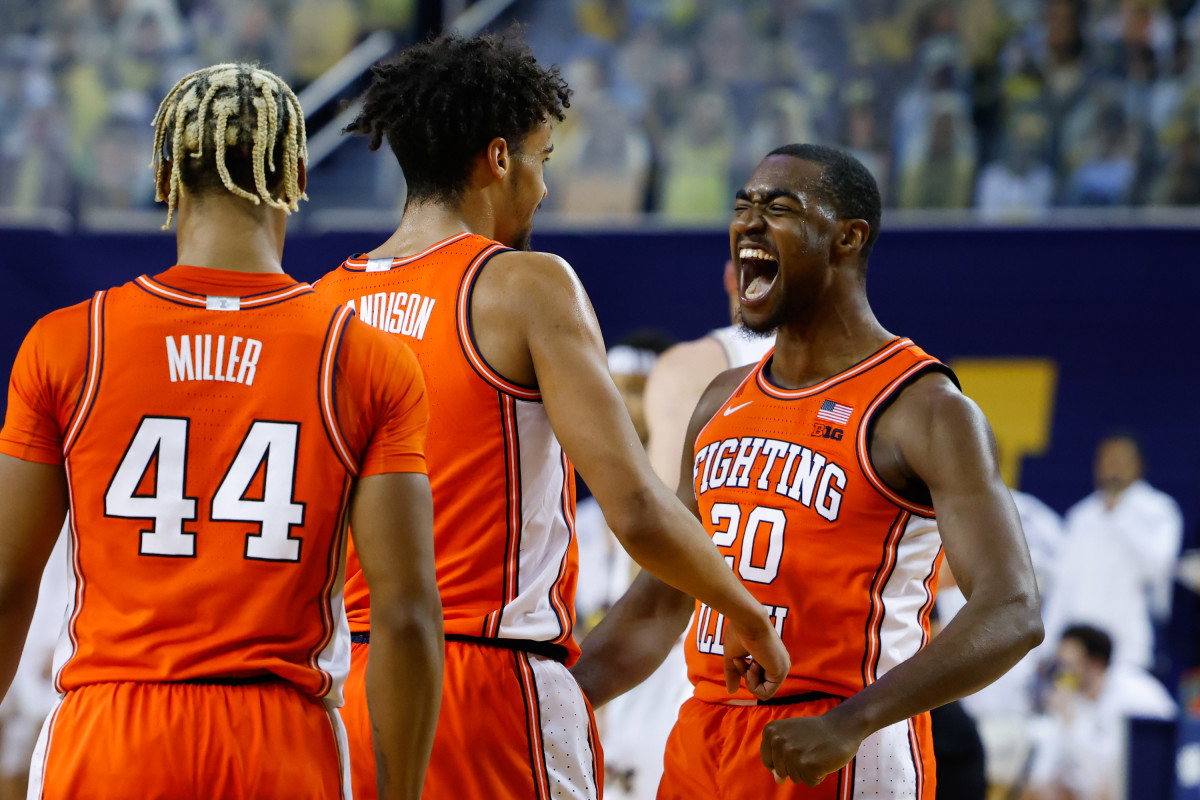 Illinois guard Da'Monte Williams (20) and guard Jacob Grandison (3) celebrate a play against Michigan during the first half Tuesday, March 2, 2021, at the Crisler Center in Ann Arbor.