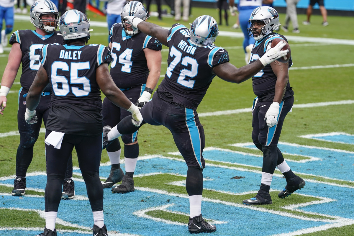 Carolina Panthers offensive tackle Taylor Moton (72) runs off the