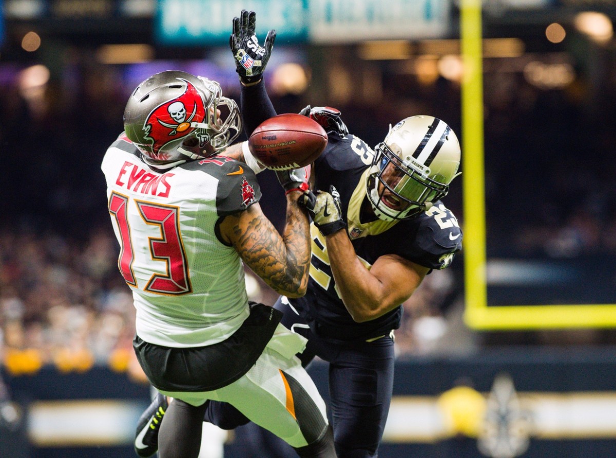 Saints cornerback Marshon Lattimore breaks up a pass thrown to Tampa Bay wide receiver Mike Evans. Mandatory Credit: Scott Clause/The Daily Advertiser via USA TODAY NETWORK