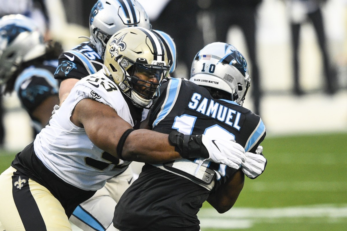 Jan 3, 2021; Charlotte, North Carolina, USA; Saints defensive tackle David Onyemata (93) tackles Panthers wide receiver Curtis Samuel (10). Mandatory Credit: Bob Donnan-USA TODAY Sports