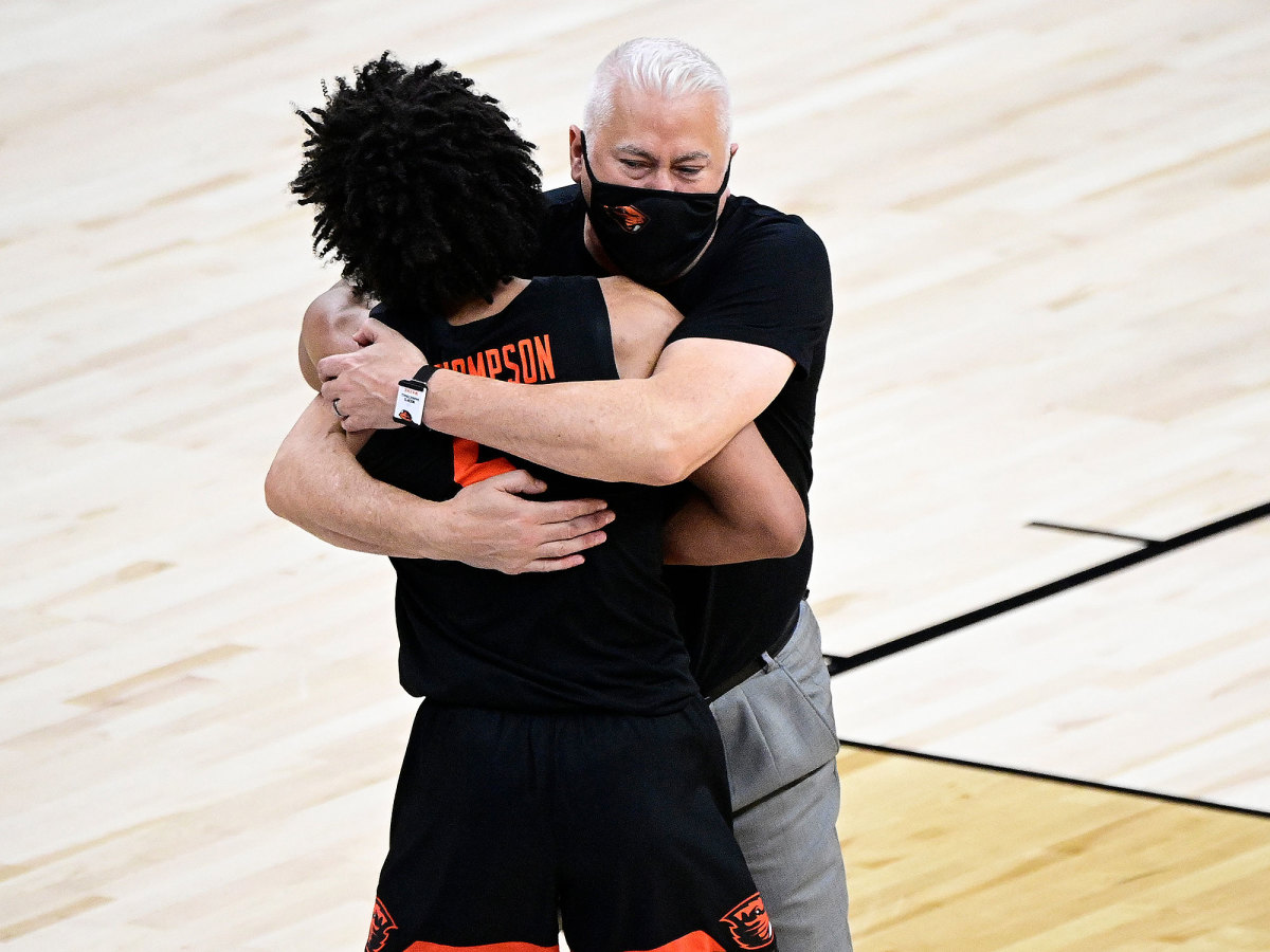 Wayne Tinkle hugs Ethan Thompson