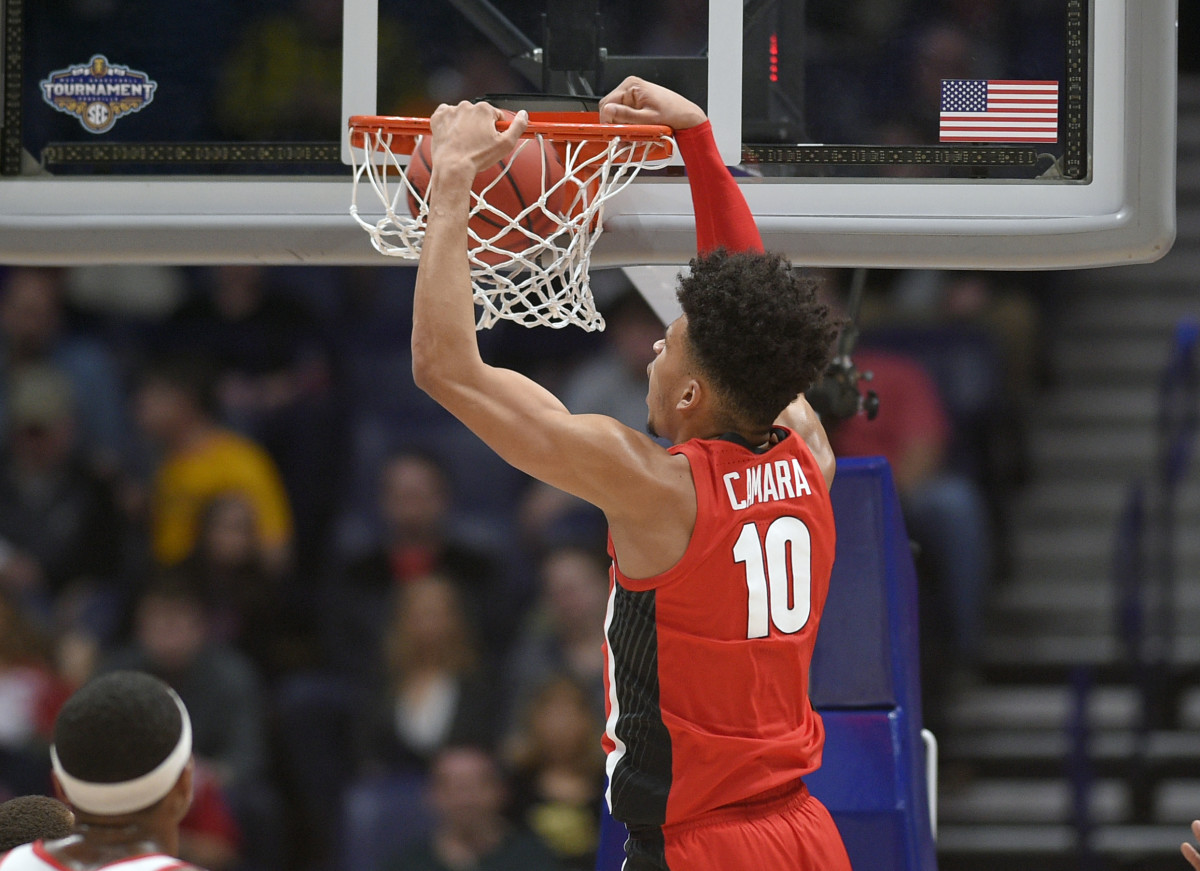 Toumani Camara dunks during round one of the SEC Tournament.