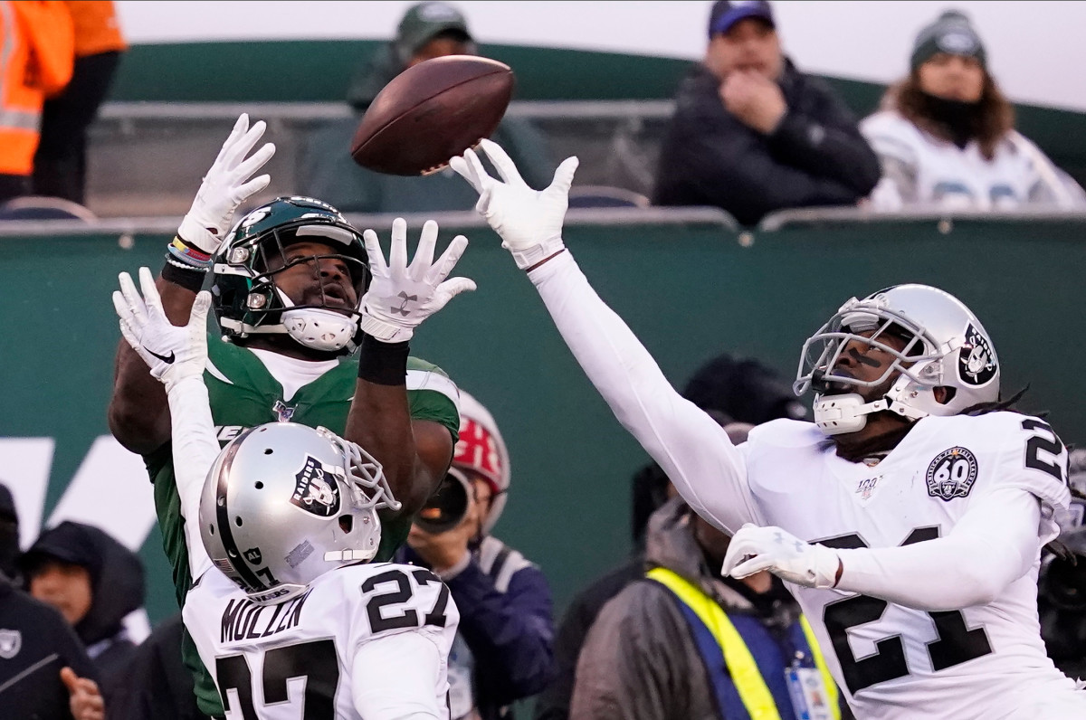 Nov 24, 2019; East Rutherford, NJ, USA; New York Jets running back Ty Montgomery (88) miss a pass against Oakland Raiders cornerback Trayvon Mullen (27) and free safety D.J. Swearinger (21) during the second half at MetLife Stadium. Mandatory Credit: Robert Deutsch-USA TODAY Sports