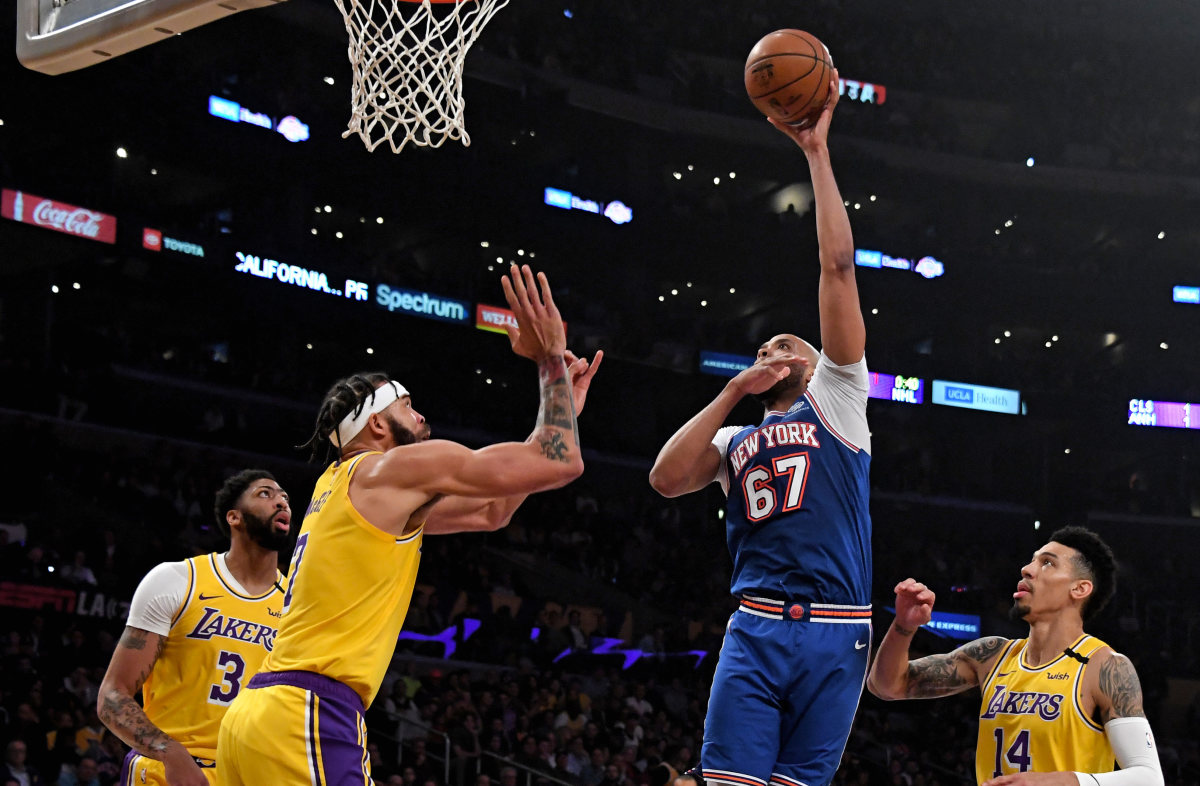 Taj Gibson shooting over JaVale McGee - Photo taken by Kirby Lee, USA Today