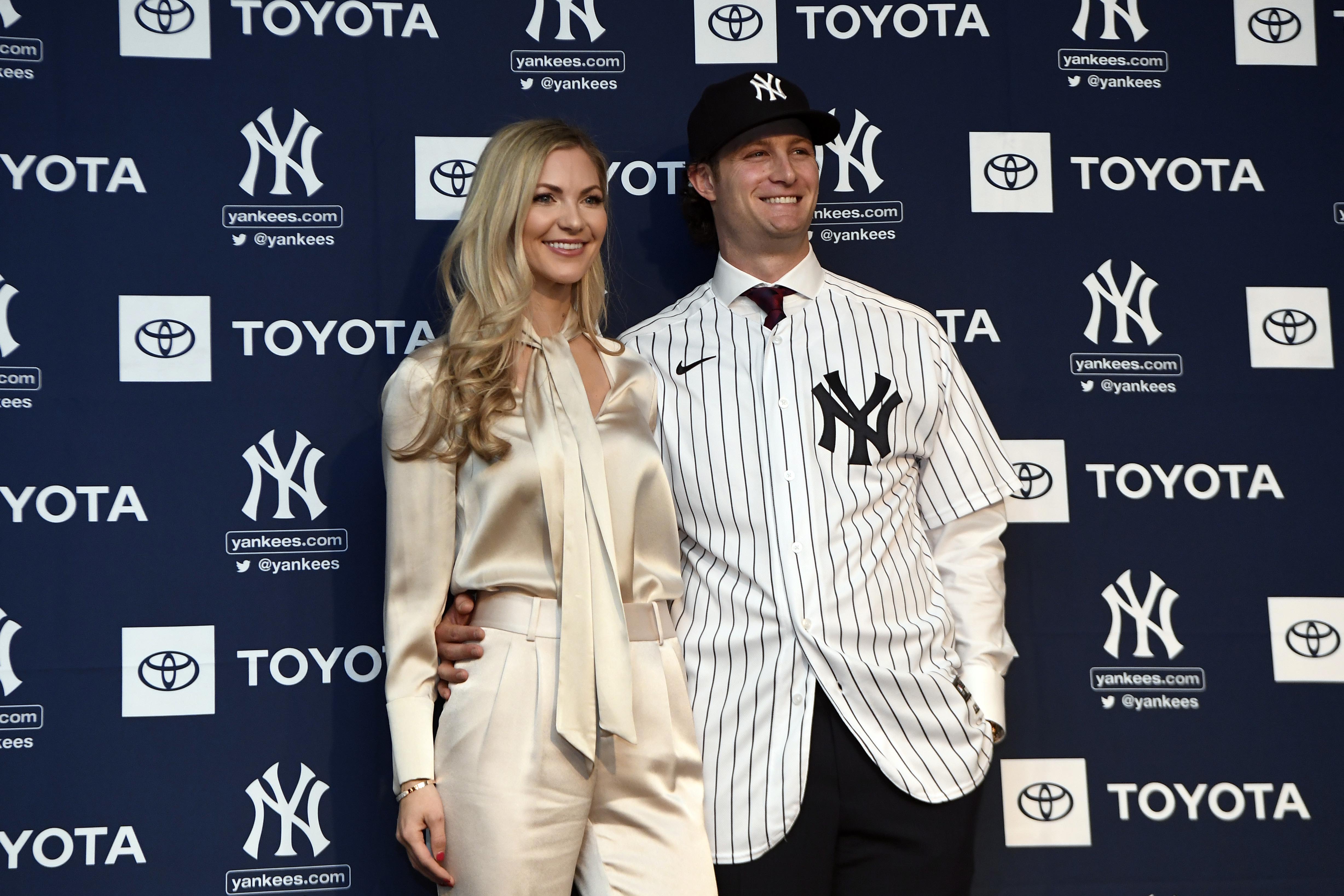 Manager Aaron Boone with Gerrit Cole and his wife Amy Cole as the New York  Yankees