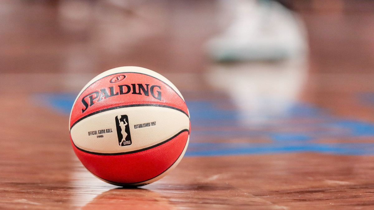 An orange and white Spalding basketball