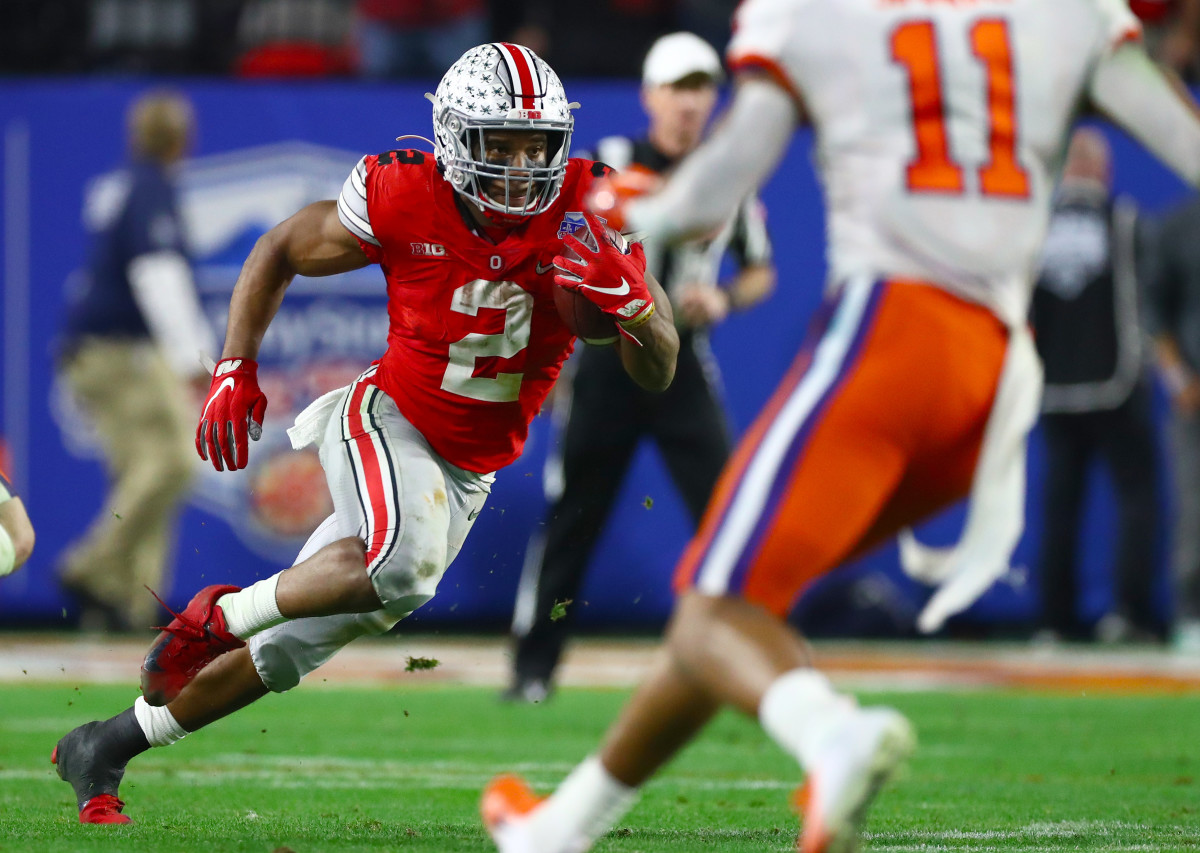 Dec 28, 2019; Glendale, Arizona, USA; Ohio State Buckeyes running back J.K. Dobbins (2) runs with the ball against the Clemson Tigers in the 2019 Fiesta Bowl college football playoff semifinal game. Mandatory Credit: Matthew Emmons-USA TODAY