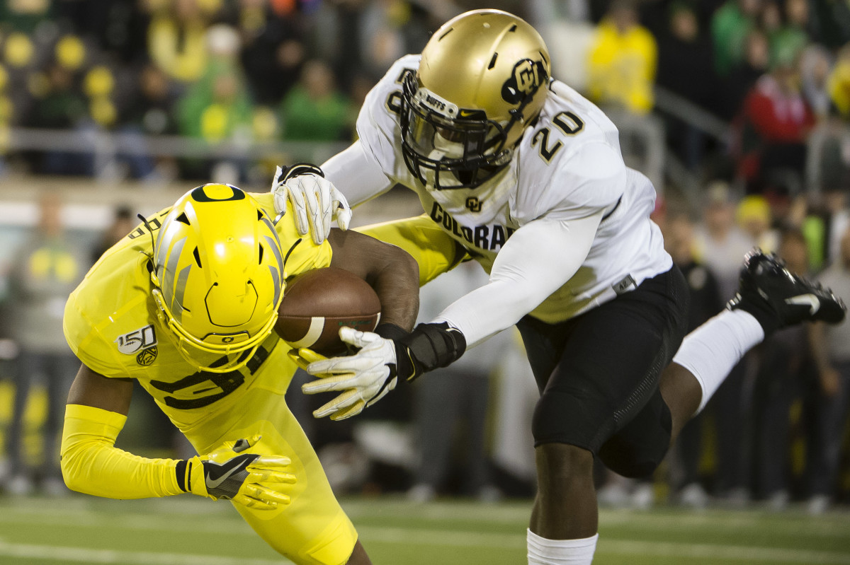 Oct 11, 2019; Eugene, OR, USA; Oregon Ducks wide receiver Jaylon Redd (30) catches a touchdown pass against Colorado Buffaloes linebacker Davion Taylor (20) during the second half at Autzen Stadium. Mandatory Credit: Troy Wayrynen-USA TODAY Sports