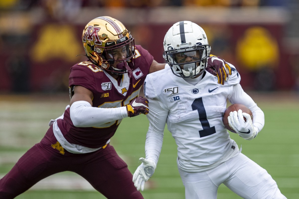 Nov 9, 2019; Minneapolis, MN, USA; Penn State Nittany Lions wide receiver KJ Hamler (1) rushes with the ball past Minnesota Golden Gophers defensive back Jordan Howden (23) in the second half at TCF Bank Stadium. Mandatory Credit: Jesse Johnson-USA TODAY Sports