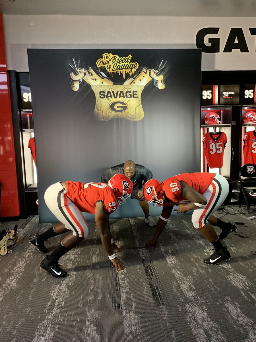 Tyler Booker in a photoshoot at UGA with Defensive Line Coach Tray Scott