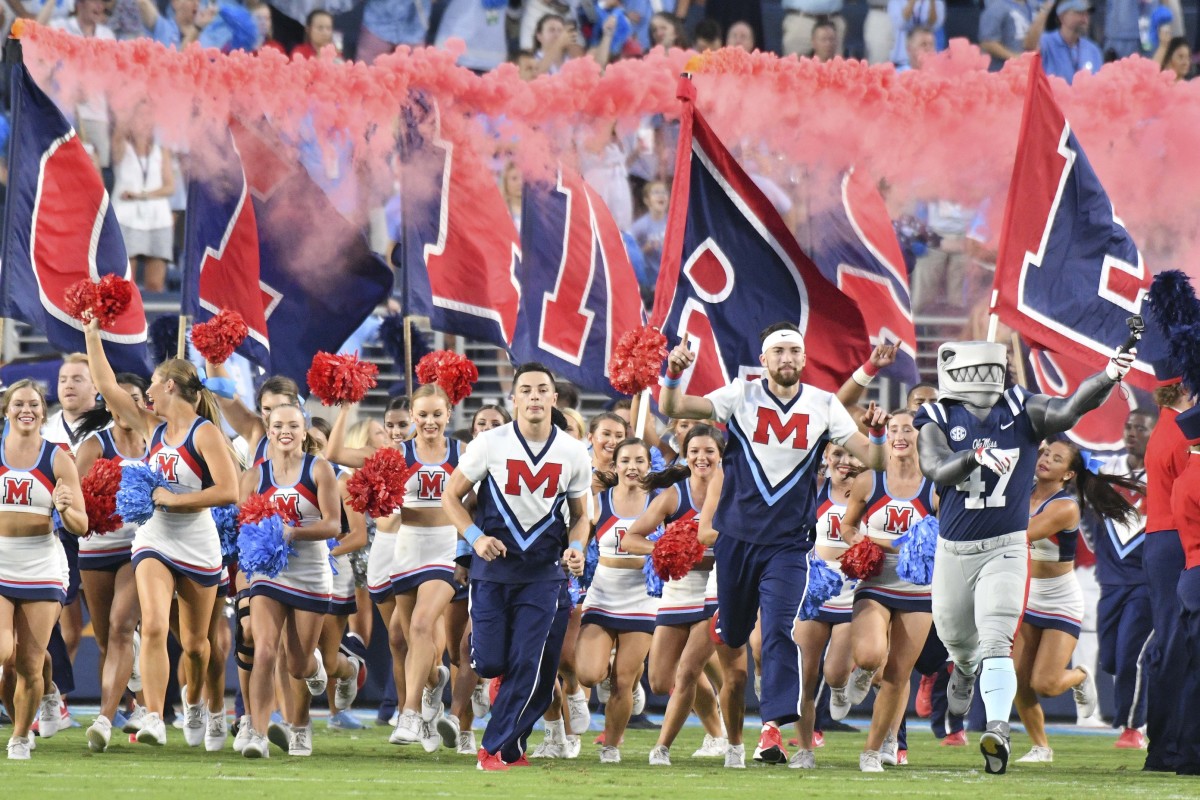 Mississippi Rebels cheerleaders lead the team onto the field before the game against the Vanderbilt Commodores at Vaught-Hemingway Stadium. Mandatory Credit: Matt Bush-USA TODAY Sports