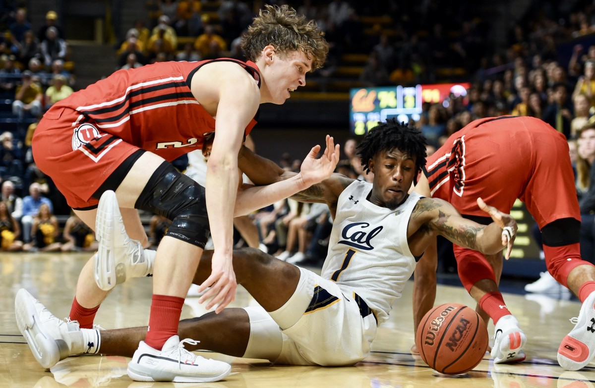 Joel Brown scrambles for a loose ball against Utah