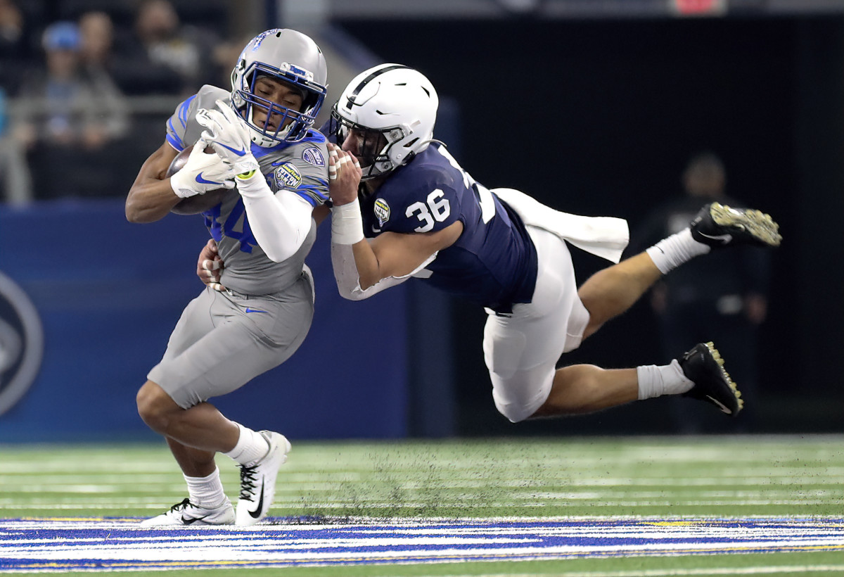 Former Penn State linebacker Jan Johnson makes a tackle at the Cotton Bowl.