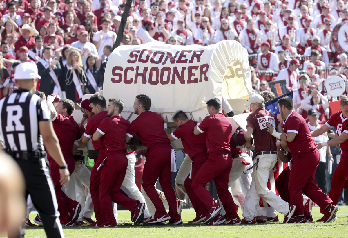 Oklahoma Ruf/Neks escort a damaged Sooner Schooner off the field on Oct. 21, 2019.