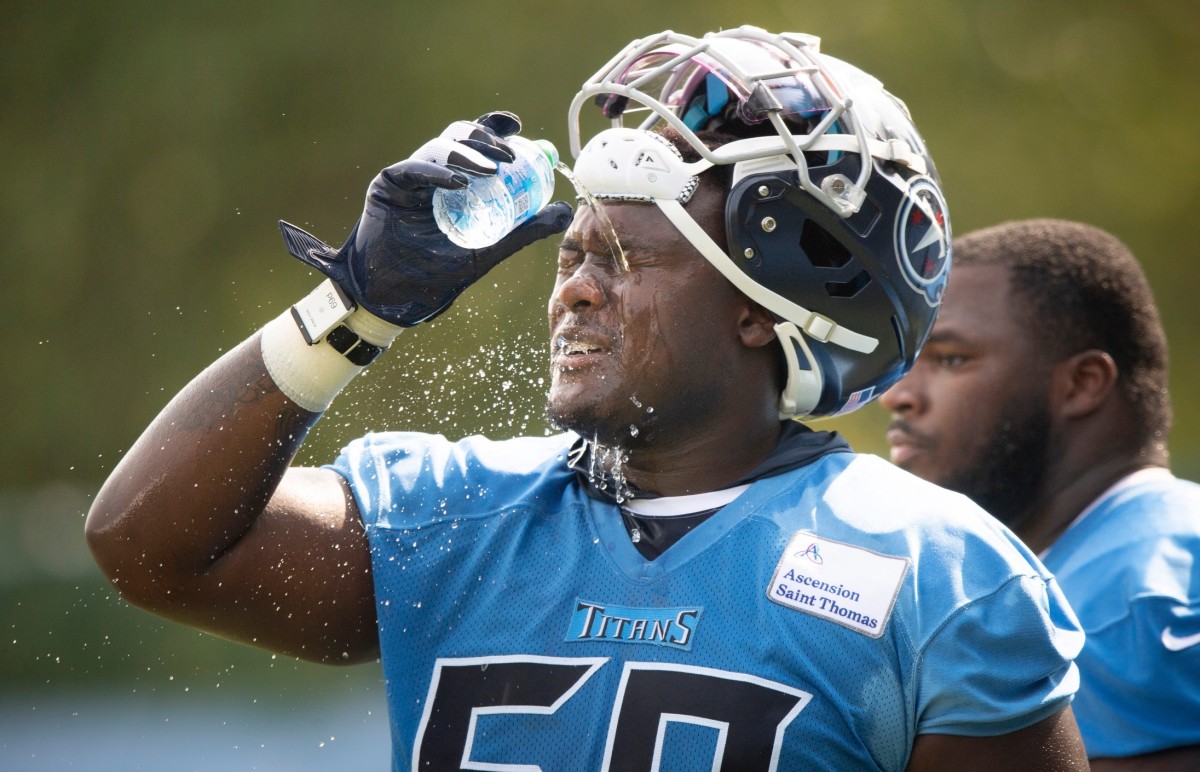 Tennessee Titans defensive tackle Naquan Jones (69) cools off during a training camp practice at Saint Thomas Sports Park Thursday, July 29, 2021 in Nashville, Tenn.