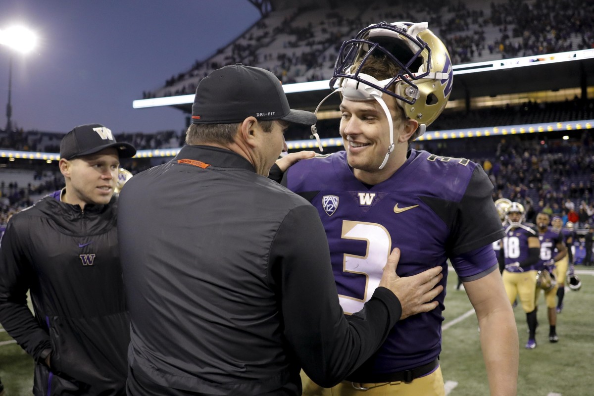 Jonathan Smith as OSU coach greets his former UW QB, Jake Browing, in 2018.