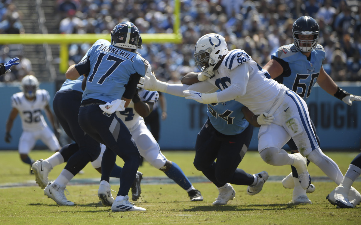 Sep 26, 2021; Nashville, Tennessee, USA; Indianapolis Colts defensive tackle DeForest Buckner (99) pressures Tennessee Titans quarterback Ryan Tannehill (17) during the first half at Nissan Stadium. Mandatory Credit: Steve Roberts-USA TODAY Sports