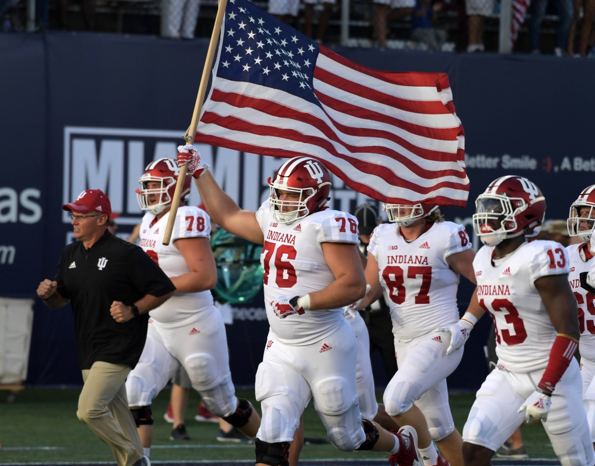 Indiana offensive lineman Wes Martin (76) leads the Hoosiers onto the field during the 2018 season opener. (Kirby Lee/USA TODAY Sports)