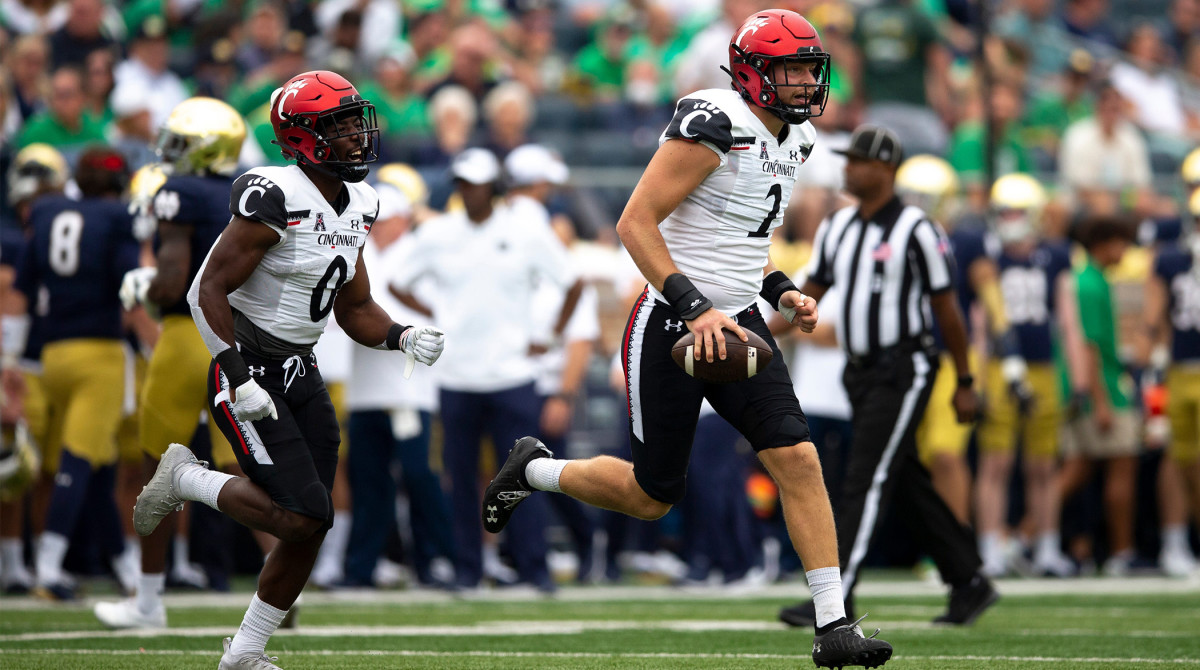 Cincinnati Bearcats linebacker Wilson Huber (2) carries the ball while celebrating recovering a fumble on a kick off in the first half of the NCAA football game between the Cincinnati Bearcats and the Notre Dame Fighting Irish on Saturday, Oct. 2, 2021, at Notre Dame Stadium in South Bend, Ind.