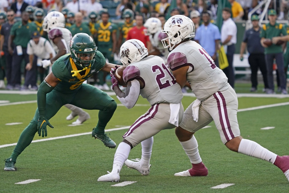 Sep 11, 2021; Waco, Texas, USA; Baylor Bears safety Jalen Pitre (8) prepares to tackle Texas Southern Tigers running back Jeff Proctor (21) as ball is handed off by quarterback Thaddeus Peyton (11) in the first quarter at McLane Stadium.