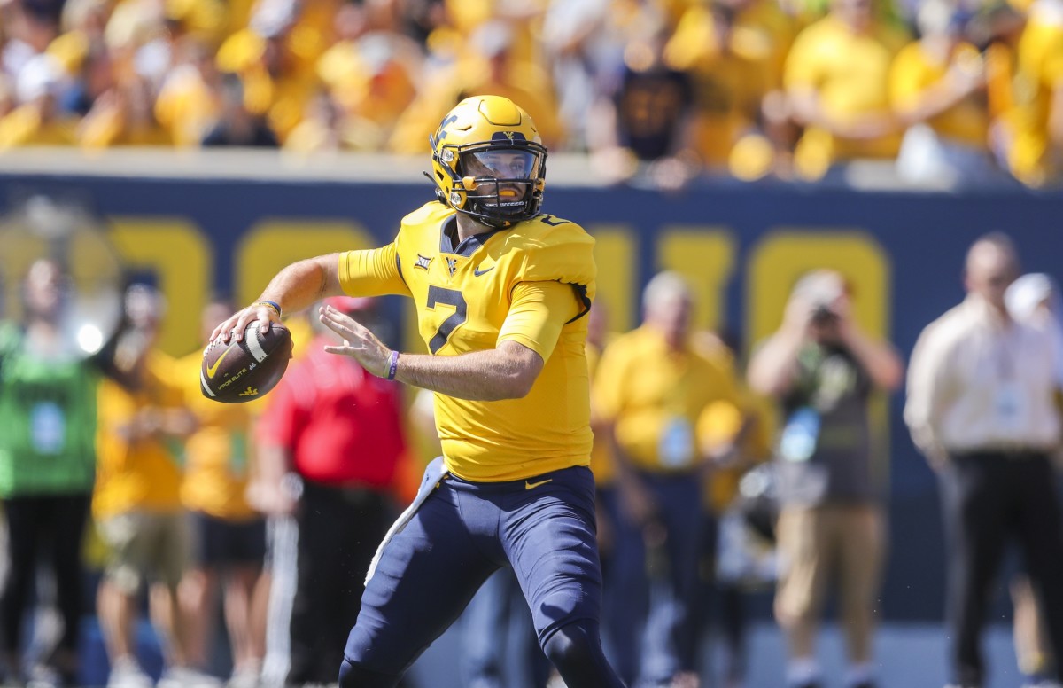 Sep 18, 2021; Morgantown, West Virginia, USA; West Virginia Mountaineers quarterback Jarret Doege (2) throws a pass during the first quarter against the Virginia Tech Hokies at Mountaineer Field at Milan Puskar Stadium.