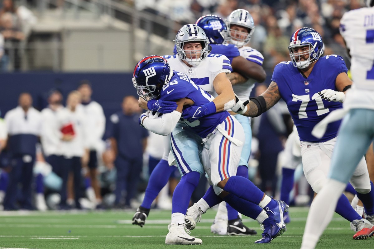 Saquon Barkley is tackled against Dallas.