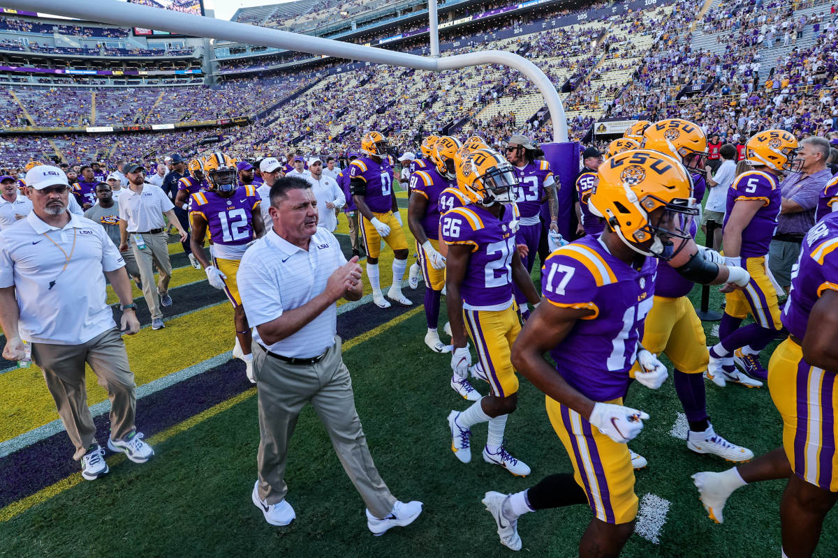 LSU Head Coach and LSU Headed to Locker Room