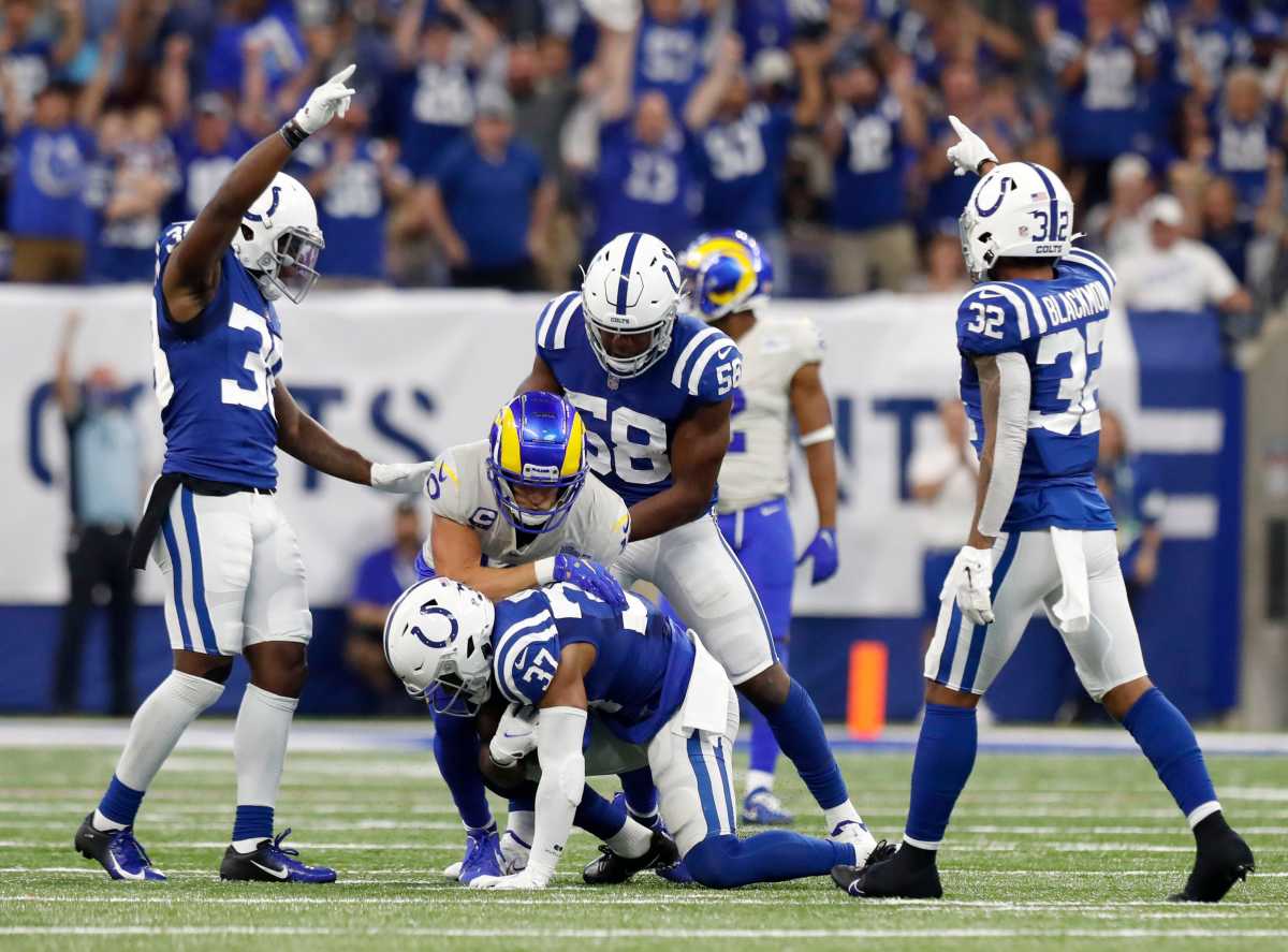 Colts players celebrate after Indianapolis Colts safety Khari Willis (37) makes an interception Sunday, Sept. 19, 2021, during a game against the Los Angeles Rams at Lucas Oil Stadium in Indianapolis.