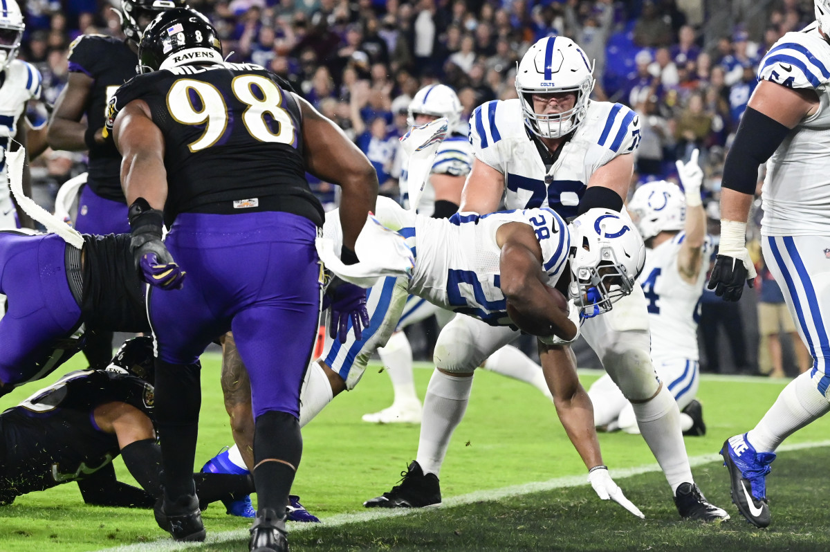 Oct 11, 2021; Baltimore, Maryland, USA; Indianapolis Colts running back Jonathan Taylor (28) dives for a third quarter touchdown against the Baltimore Ravens at M&T Bank Stadium.