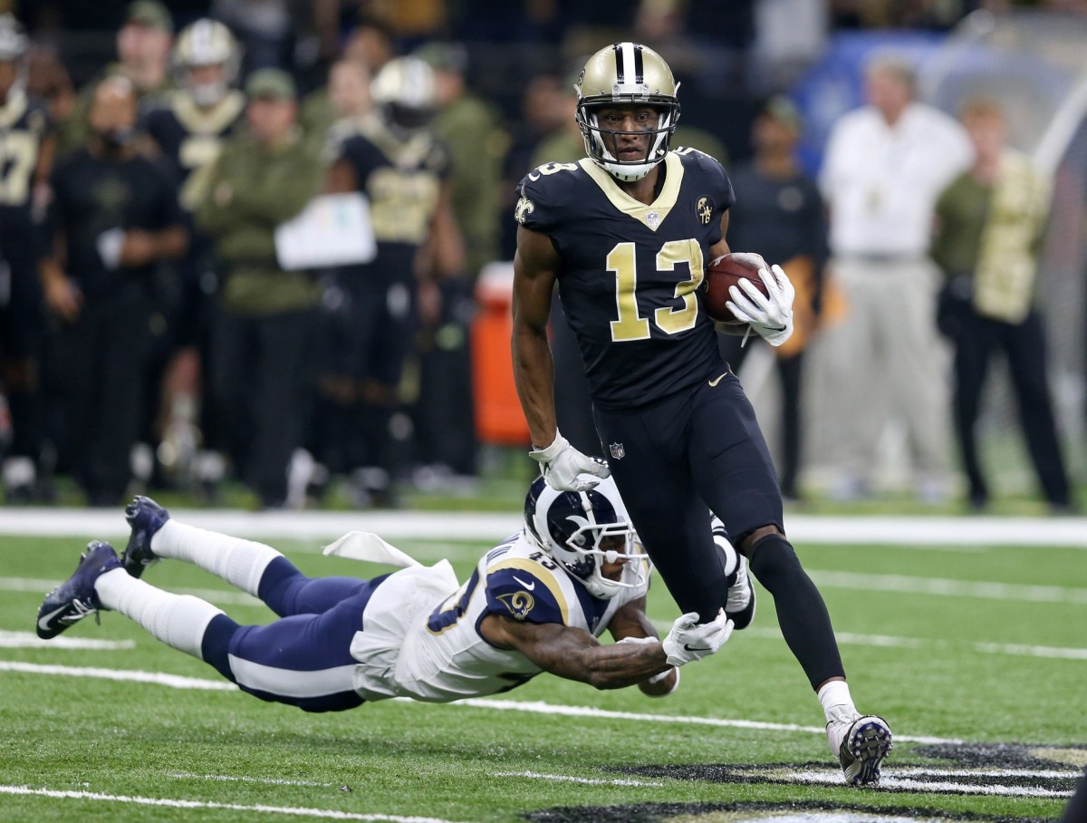 New Orleans Saints receiver Michael Thomas (13) runs away from Los Angeles Rams safety John Johnson (43). Mandatory Credit: Chuck Cook-USA TODAY Sports