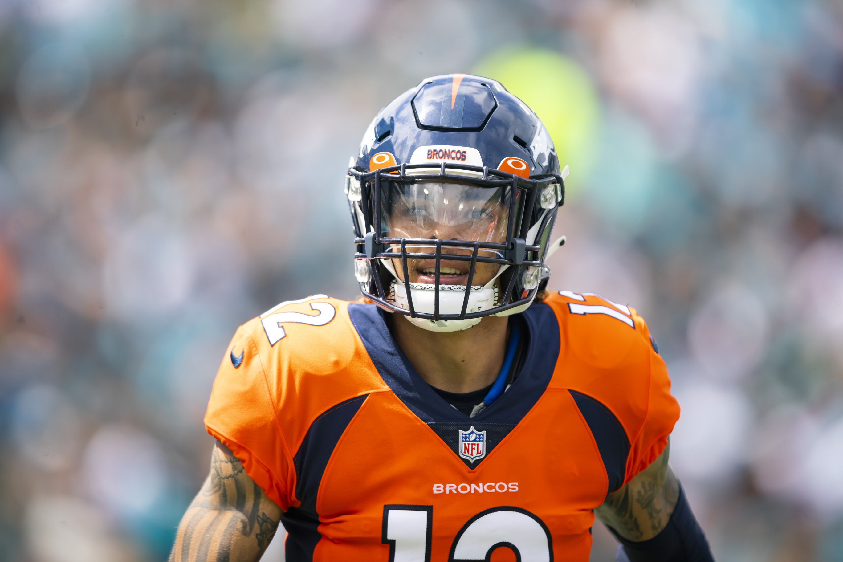 Denver Broncos defensive back Mike Ford (12) walks off the field