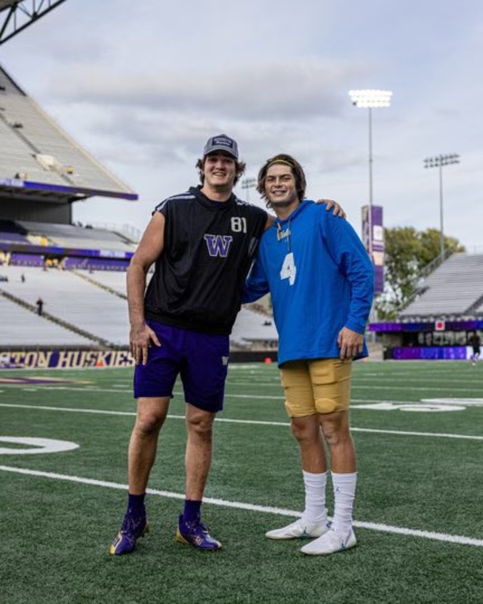 UW tight end Mark Redman shares a moment with UCLA quarterback Ethan Garbers. They were high school and Husky teammates.