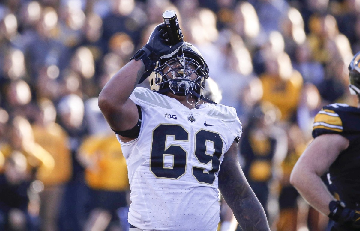 Purdue offensive lineman Greg Long pours a can of Bud Light over his face after an Iowa fan tossed the beer onto the field during the Boilermakers' upset of the Hawkeyes on Oct. 16. (Bryon Houlgrave/The Register-USA TODAY Sports)