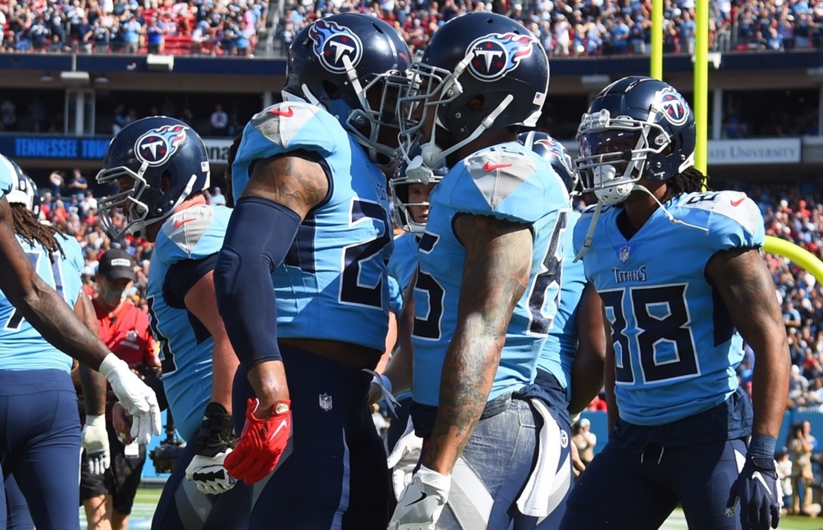 Tennessee Titans running back Derrick Henry (22) celebrates with Tennessee Titans tight end MyCole Pruitt (85) after a touchdown during the first half against the Kansas City Chiefs at Nissan Stadium.