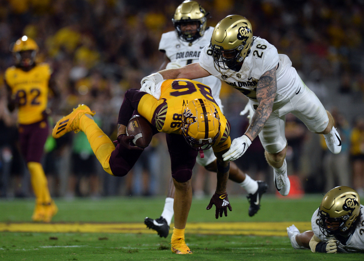 Colorado Buffaloes linebacker Carson Wells (26) tackles Arizona State Sun Devils tight end Curtis Hodges (86).