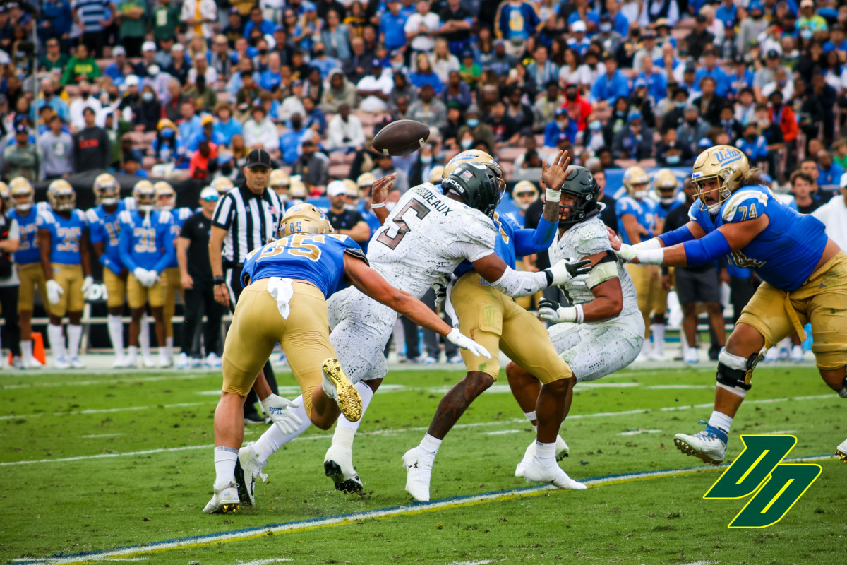 Thibodeaux slams into UCLA quarterback Dorian Thompson-Robinson during a game on October 23, 2021 at the Rose Bowl in Pasadena.