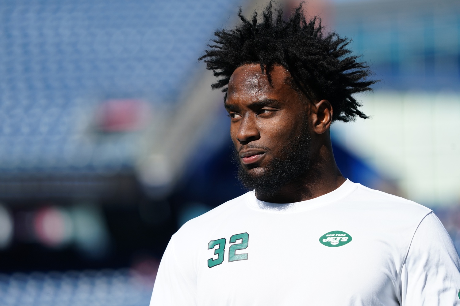 New York Jets running back Michael Carter (32) warms up before taking on  the Miami Dolphins during an NFL football game Sunday, Oct. 9, 2022, in  East Rutherford, N.J. (AP Photo/Adam Hunger