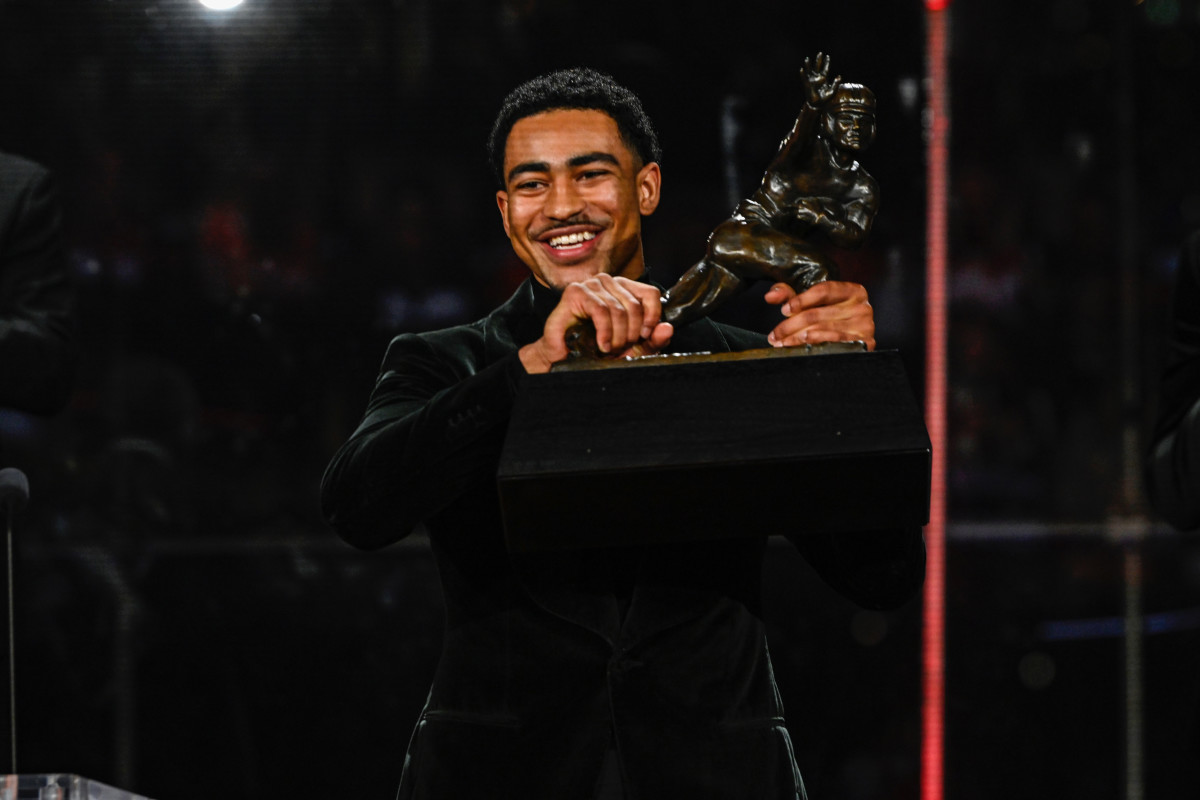 Bryce Young and his new trophy