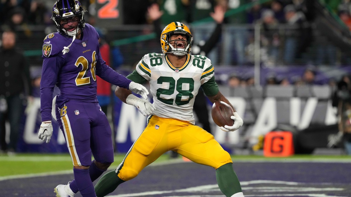 BALTIMORE, MD - DECEMBER 19: Packers wide receiver Davante Adams (17) runs  after a catch during the Green Bay Packers versus Baltimore Ravens NFL game  at M&T Bank Stadium on December 19