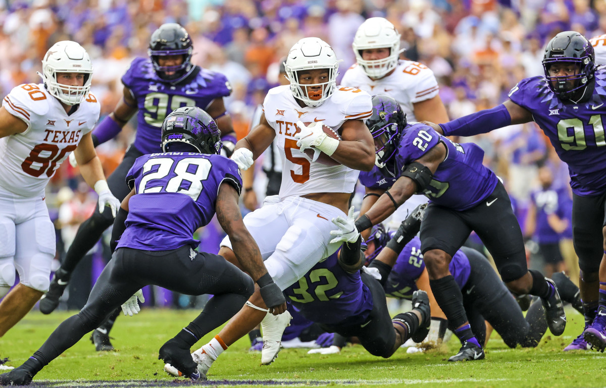 A swarm of Horned Frogs close in on Texas running back Bijan Robinson at Amon G. Carter Stadium on Oct. 2.