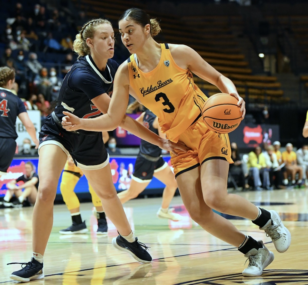 Sophomore guard Dalayah Daniels drives against Saint Mary's defender.