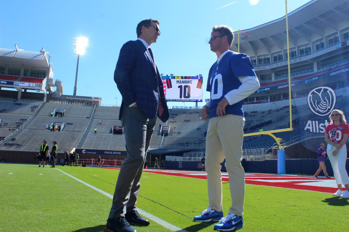 Lane Kiffin and Eli Manning