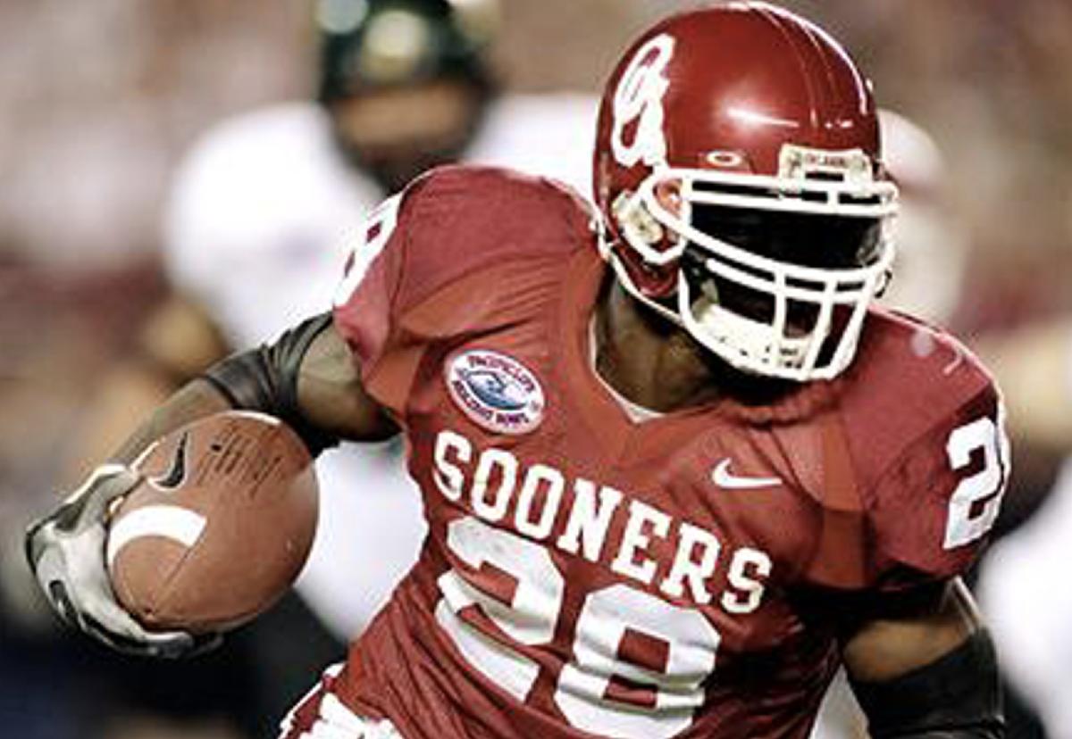 Adrian Peterson Oklahoma Sooners Unsigned Crimson Jersey Scoring Touchdown  vs. Kansas State Photograph