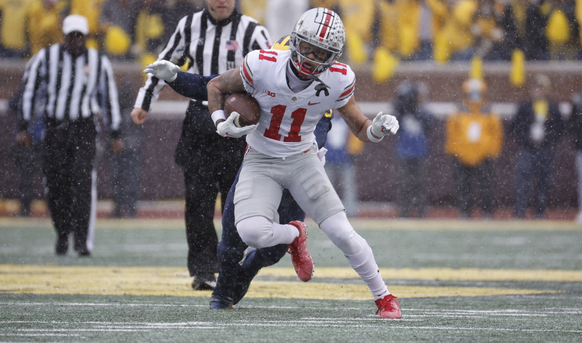 All American receiver Jaxon Smith-Njigba runs after a reception against Michigan in late November.