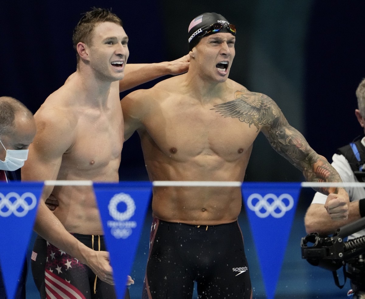 Ryan Murphy, left, celebrates relay gold with Caeleb Dressel