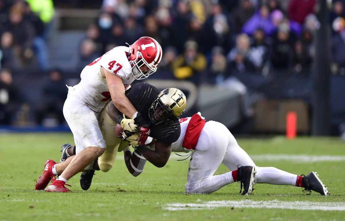 Purdue running back King Doerue (22) is tackled by Indiana linebacker Micah McFadden (47) and defensive back Marcelino McCrary-Ball (9) during the second quarter at Ross-Ade Stadium. (Marc Lebryk-USA TODAY Sports)