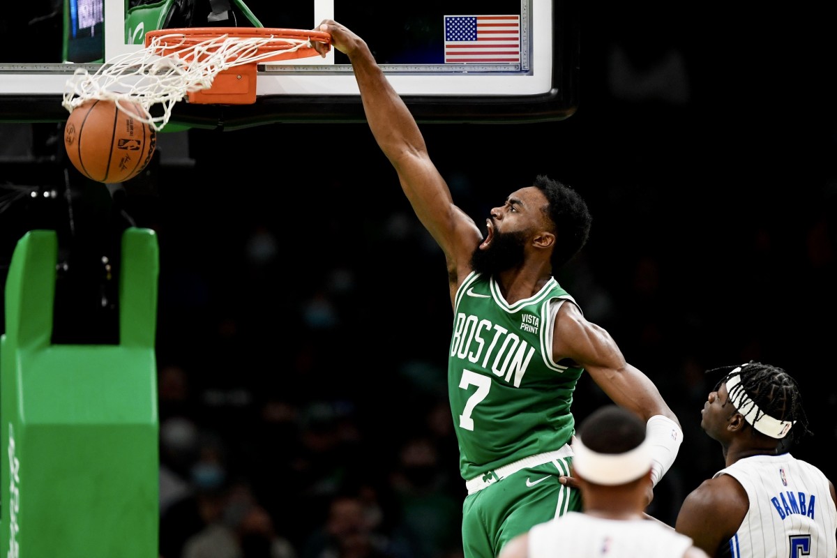 Jaylen Brown dunks against the Orlando Magic